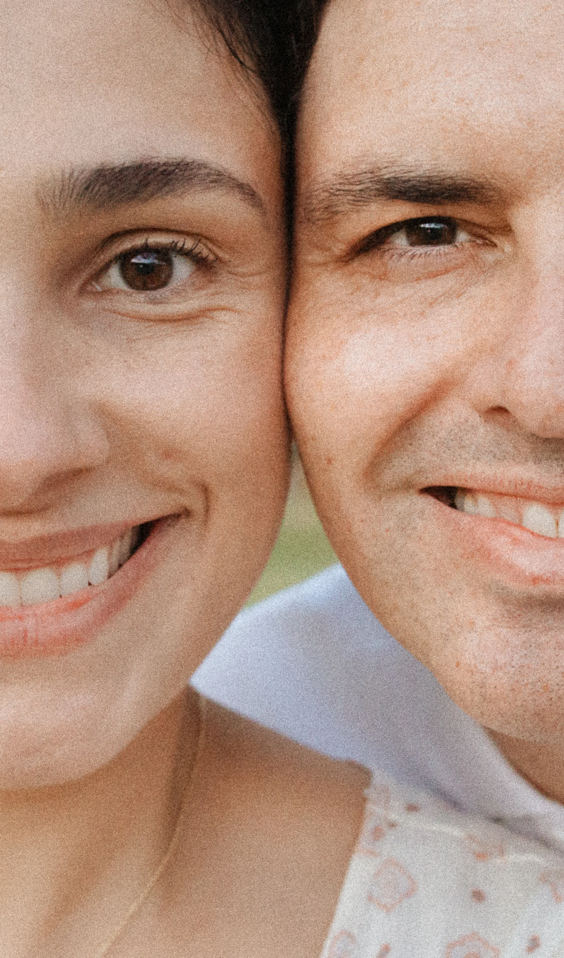 Close up of a smiling couple pressing their cheeks together in warm natural light, family session.
